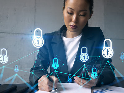 Businesswoman at a desk with security lock icons